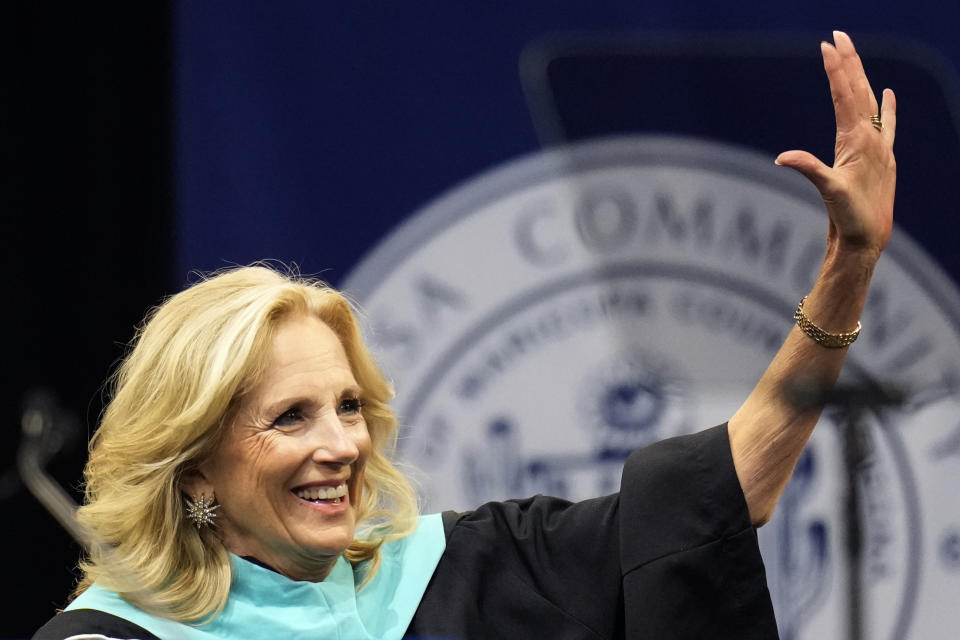 First lady Jill Biden smiles as she waves to the crowd before speaking at the Mesa Community College commencement Saturday, May 11, 2024, in Tempe, Ariz. (AP Photo/Ross D. Franklin)