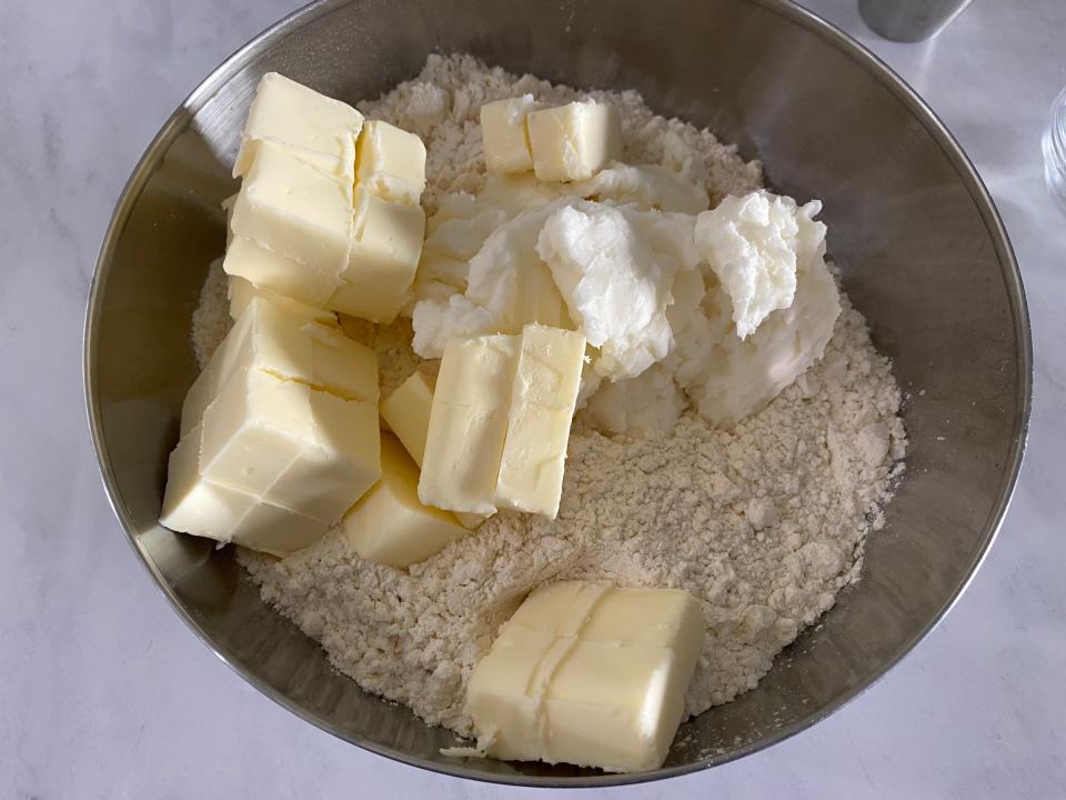 Butter, flour, and sugar in a bowl.