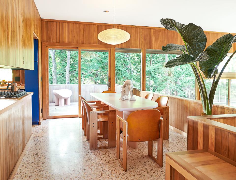 In the dining room, Afra and Tobia Scarpa leather chairs surround a Sabine Marcelis resin table. Arsham Studio R2D2.