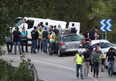 A funeral van is parked in the place where Younes Abouyaaqoub, the man suspected of driving the van that killed 13 people in Barcelona last week, was killed by police in Subirats, Spain, August 21, 2017. REUTERS/Albert Gea