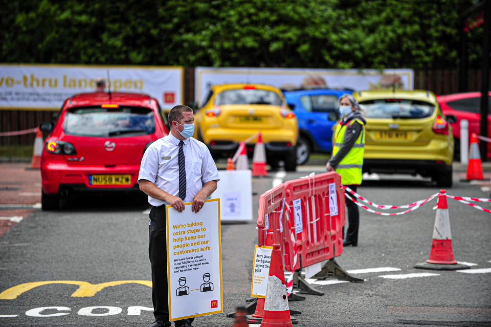  Manager of the branch holding a sign at the car parking during the reopening.
McDonald's reopens its Alloa branch on Clackmannan Road as Drive-Thru only and implementing a one-way system to keep the flow of traffic going. (Photo by Stewart Kirby / SOPA Images/Sipa USA) 