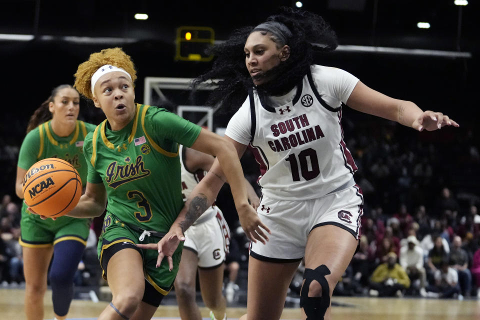 Notre Dame guard Hannah Hidalgo drives to the basket as South Carolina center Kamilla Cardoso defends during the second half of an NCAA women's college basketball game on Nov. 6, 2023, in Paris. (AP Photo/Thibault Camus)
