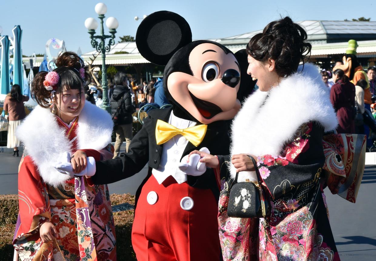 Happy patrons at Tokyo Disneyland: Getty