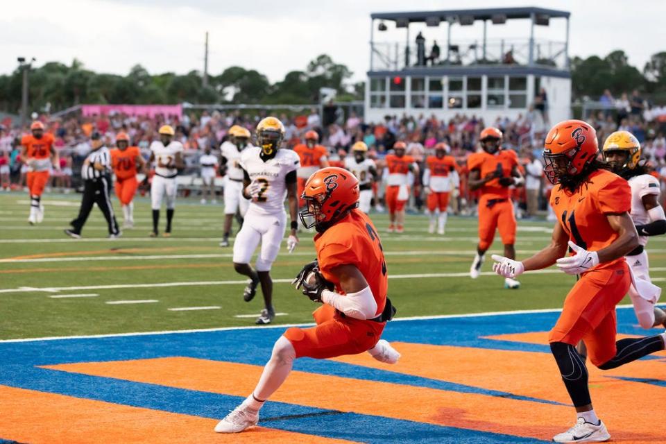 Benjamin football's Amaree Williams (3) catches a touchdown pass against Ed White (Jacksonville) on Friday, Oct. 27, 2023.