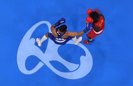 Rio Olympics - Boxing - Preliminary - Men's Light Fly (49kg) Round of 32 Bout 1 - Riocentro - Pavilion 6 - Rio de Janeiro, Brazil - 06/08/2016. Simplice Fotsala (CMR) of Cameroon and Galal Yafai (GBR) of United Kingdom compete. REUTERS/Pool