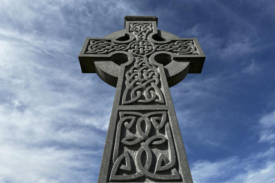 A Celtic Cross at Hibernian Memorial Park in New Orleans is seen on Thursday, March 7, 2024. The park sits on the site of the now filled-in New Basin Canal and is a tribute to Irish laborers who built the canal in the 1800s. Although New Orleans is better known for French, Spanish, African American and Caribbean influences, the Irish have played a major role in the its history, and the city celebrates the legacy with parades and parties centered around the March 17 St. Patrick's Day holiday. (AP Photo/Stephen Smith)