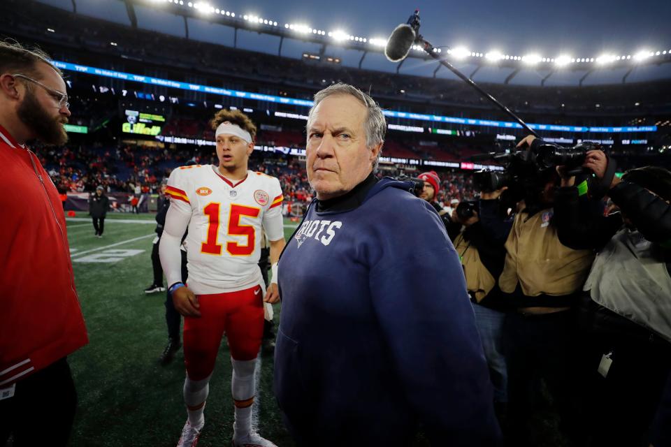 New England Patriots head coach Bill Belichick, center, turns away after shaking hands with Kansas City Chiefs quarterback Patrick Mahomes (15) following an NFL football game, Sunday, Dec. 17, 2023, in Foxborough, Mass. (AP Photo/Michael Dwyer)