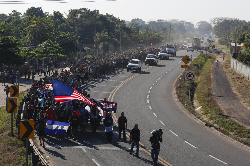 Central American migrants walk in Ciudad Hidalgo, Mexico, Thursday, Jan. 23, 2020. Hundreds of migrants hoping to reach the United States marooned in Guatemala crossed the Suchiate River into Mexico in a second attempt to convince authorities there to allow them passage through the country. (AP Photo/Marco Ugarte)