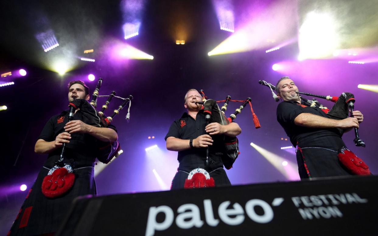 Pipers of Scottish ensemble "Red Hot Chilli Pipers" perform during the 41st edition of Paleo on July 20, 2016 in Nyon, the biggest open-air music festival in Switzerland - AFP