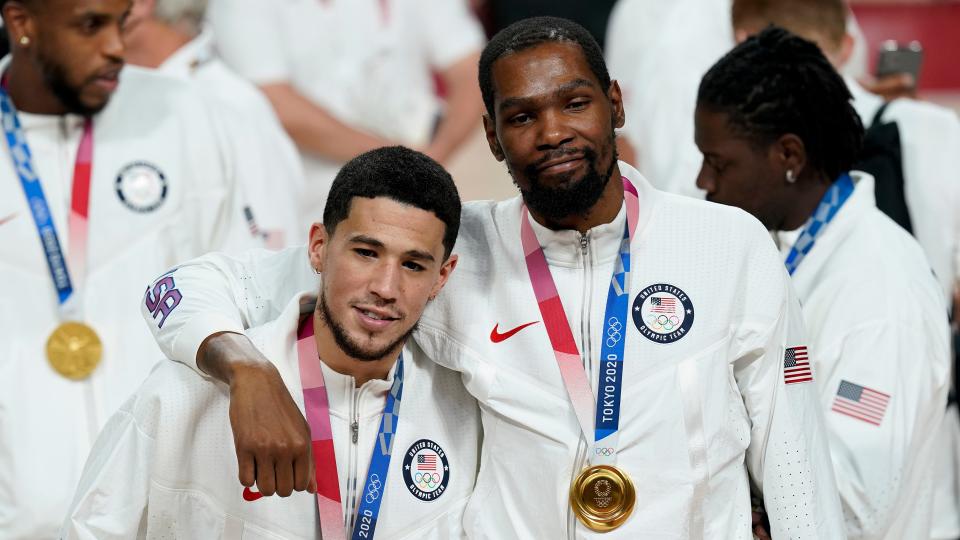 Devin Booker and Kevin Durant pose for a photo during the medal ceremony for basketball game at the 2020 Summer Olympics, Saturday, Aug. 7, 2021, in Tokyo, Japan.