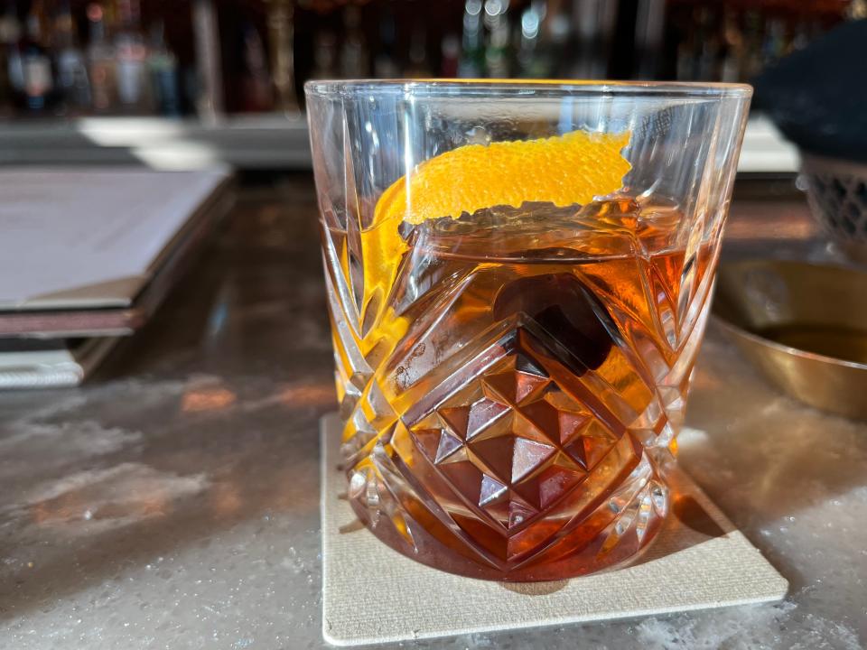 modern old fashioned cocktail from topolino's terrace at disney's riviera resort