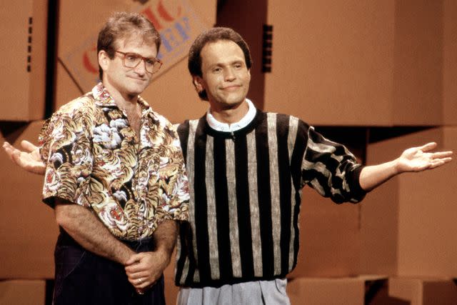 <p>Bob Riha, Jr./Getty</p> Robin Williams and Billy Crystal on March 29, 1986