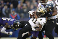 <p>New Orleans Saints running back Alvin Kamara (41) is tackled by Baltimore Ravens cornerback Tavon Young, left, and linebacker Tim Williams as he rushes the ball in the second half of an NFL football game, Sunday, Oct. 21, 2018, in Baltimore. (AP Photo/Nick Wass) </p>
