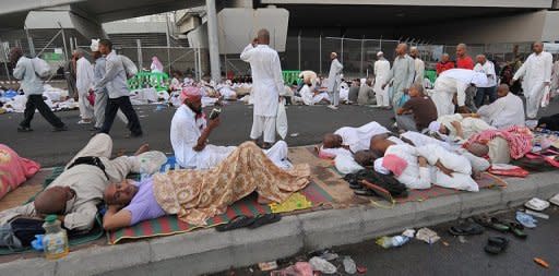 Muslim pilgrims wait in the street for their turn to take part in the "Jamarat" ritual, or the the stoning of Satan, by throwing pebbles at pillars in Mina near the holy city of Mecca