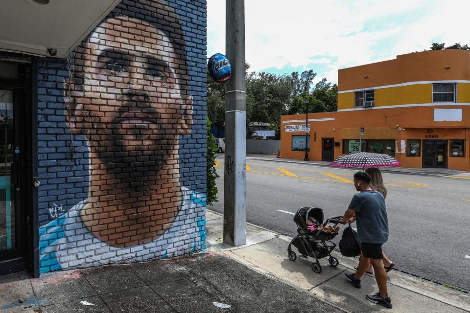 people walk in front of a mural depicting argentine football player lionel messi in miami on june 7, 2023 lionel messi on wednesday announced he will sign for major league soccer side inter miami, choosing the united states as his next destination over a barcelona reunion or blockbuster deal to play in saudi arabia photo by giorgio viera afp photo by giorgio vieraafp via getty images