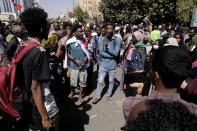 People chant slogans during a demonstration against the killing of dozens by Sudanese security forces since a military coup three months ago, in Khartoum, Sudan, Monday, Jan. 24, 2022. (AP Photo/Marwan Ali)