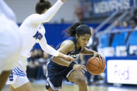 Connecticut guard Chrystal Dangerfield, right, drives to the basket defended by Memphis guard Aerial Wilson, left, in the first half of an NCAA college basketball game Tuesday, Jan. 14, 2020, in Memphis, Tenn. (AP Photo/Nikki Boertman)