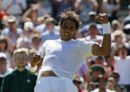 Rafael Nadal of Spain celebrates after winning his match against Thomaz Bellucci of Brazil at the Wimbledon Tennis Championships in London, June 30, 2015. REUTERS/Stefan Wermuth