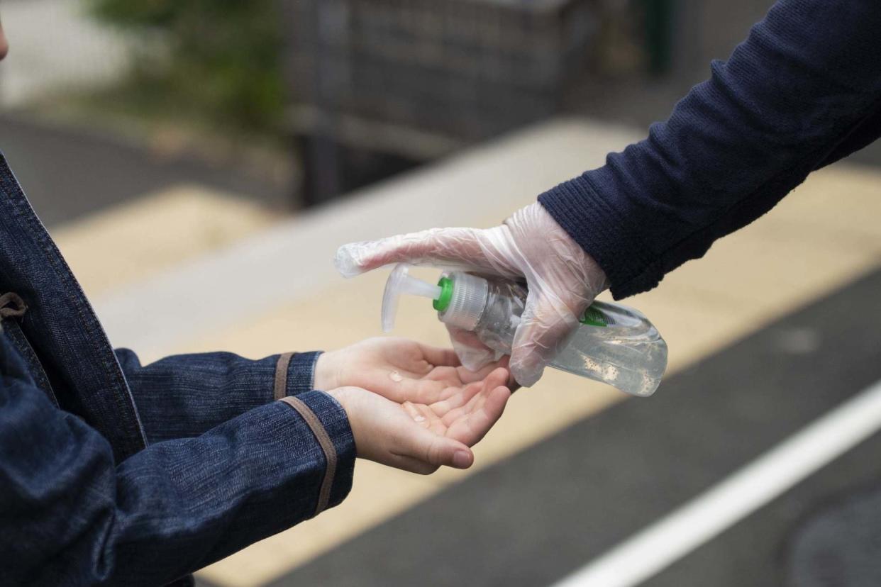 A file picture of a child being given hand sanitiser: Getty Images