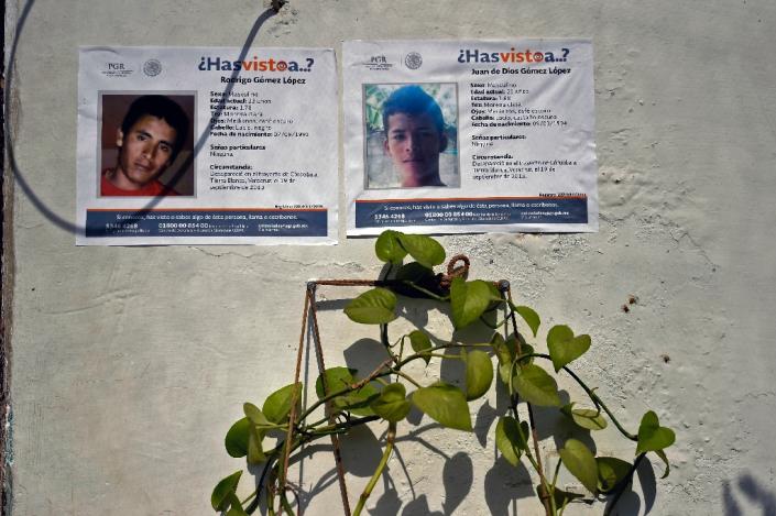 Posters show two of five youngsters who went missing on January 11, hang on the wall of the public prosecutor's office in Tierra Blanca community, Veracruz State, Mexico on January 26, 2016 (AFP Photo/Alfredo Estrella)