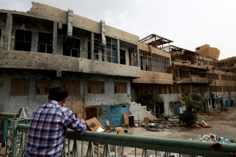 A member of a first response team tours the courtyard of the National Hospital in the northern Syria city of Raqa on October 13, 2018