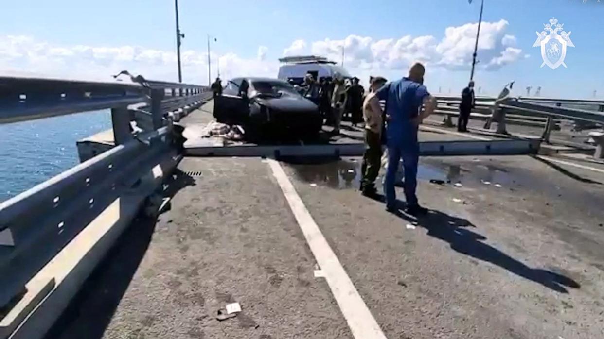 Russian investigators were shown working at the scene of an overnight incident that damaged the Crimean bridge in video posted by Russia’s Investigative Committee on Monday (RUSSIAN INVESTIGATIVE COMMITTEE/)