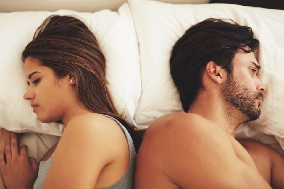 Couple going to sleep mad at each other
