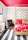 <p>A kid's room is the perfect location to experiment with painting your ceiling bright color. Here, the designer chose a vibrant shade of pink/red to correspond with the floral print bedding. </p>