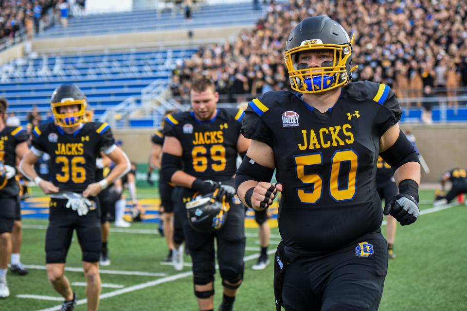 SDSU's Nick Wells (50) runs on the football field before the game against Montana State at Dana J Dykhouse Stadium in Brookings, South Dakota on Saturday, Sept. 9, 2023.