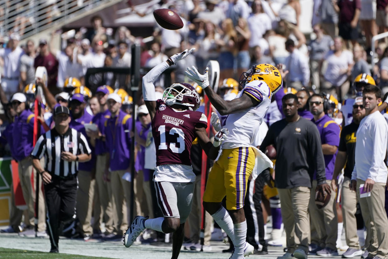 Mississippi State cornerback Emmanuel Forbes (13) knocks away a pass intended for LSU wide receiver Kayshon Boutte (1) during the first half of an NCAA college football game, Saturday, Sept. 25, 2021, in Starkville, Miss. LSU won 28-25. (AP Photo/Rogelio V. Solis)