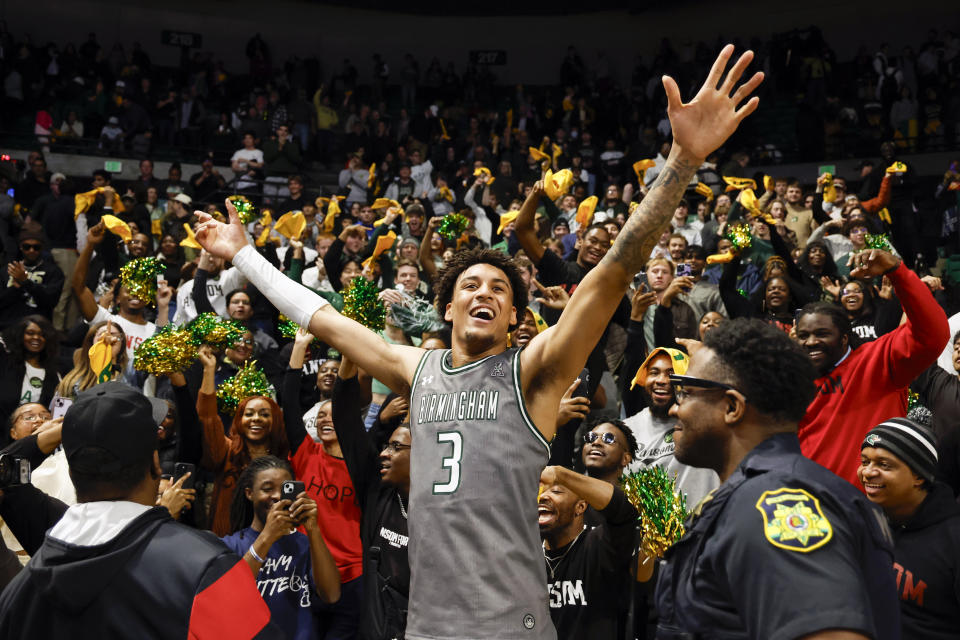 UAB forward Yaxel Lendeborg (3) celebrates with fans after the team defeated Memphis in an NCAA college basketball game, Sunday, Jan. 28, 2024, in Birmingham, Ala. (AP Photo/ Butch Dill)