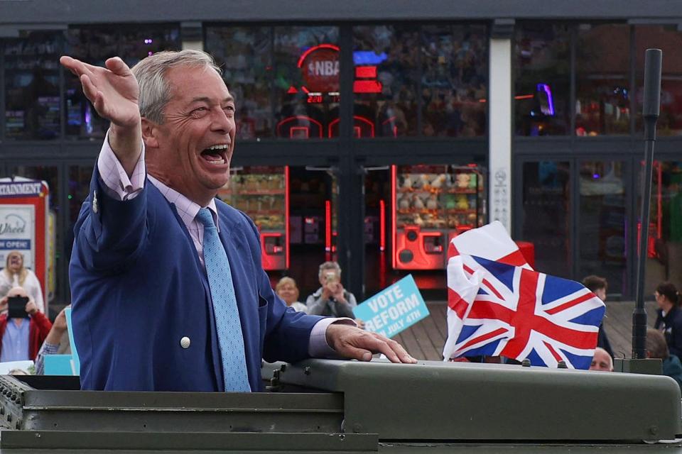 Reform UK party leader Nigel Farage speaks to the crowd as he arrives in a land rover to deliver a stump speech to supporters on July 3, 2024 in Clacton-on-Sea, England.