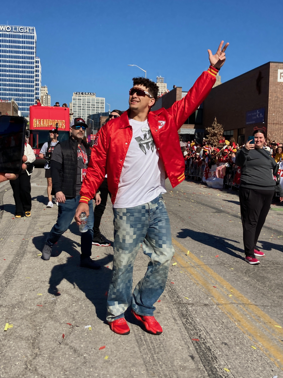 Chiefs quarterback Patrick Mahomes celebrates with fans along the Super Bowl victory parade route in Kansas City on Wednesday, Feb. 14, 2024. Eric Adler/The Star