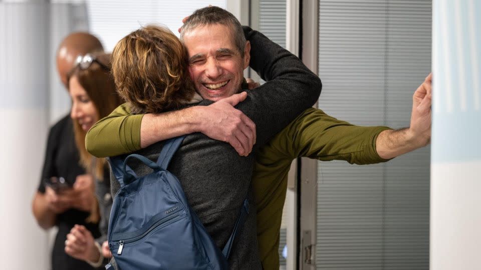 Fernando Simon Marman reunites with a loved one at Sheba Medical Center, in Ramat Gan, Israel, on Monday. - IDF