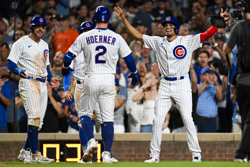 The Chicago Cubs have managed to turn around their season, thanks to big contributions from Nico Hoerner (2), Mike Tauchman (left) and others. (Photo by Quinn Harris/Getty Images)