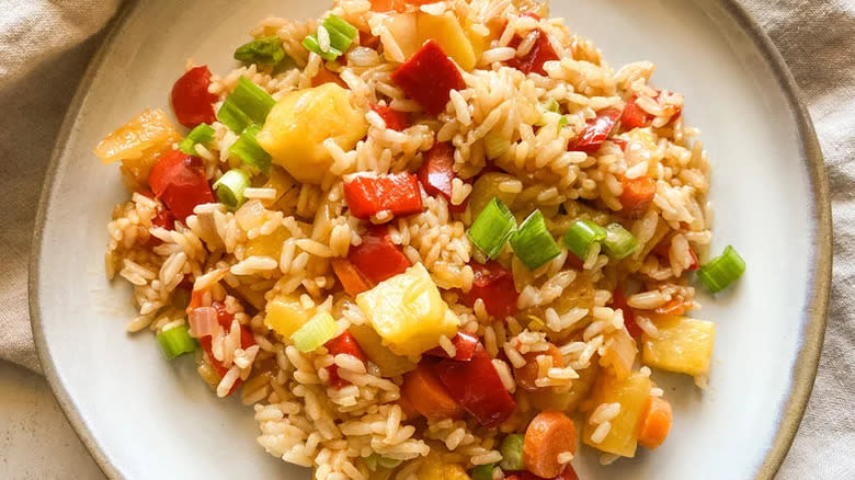 Fried rice with pineapple, carrots, and peppers