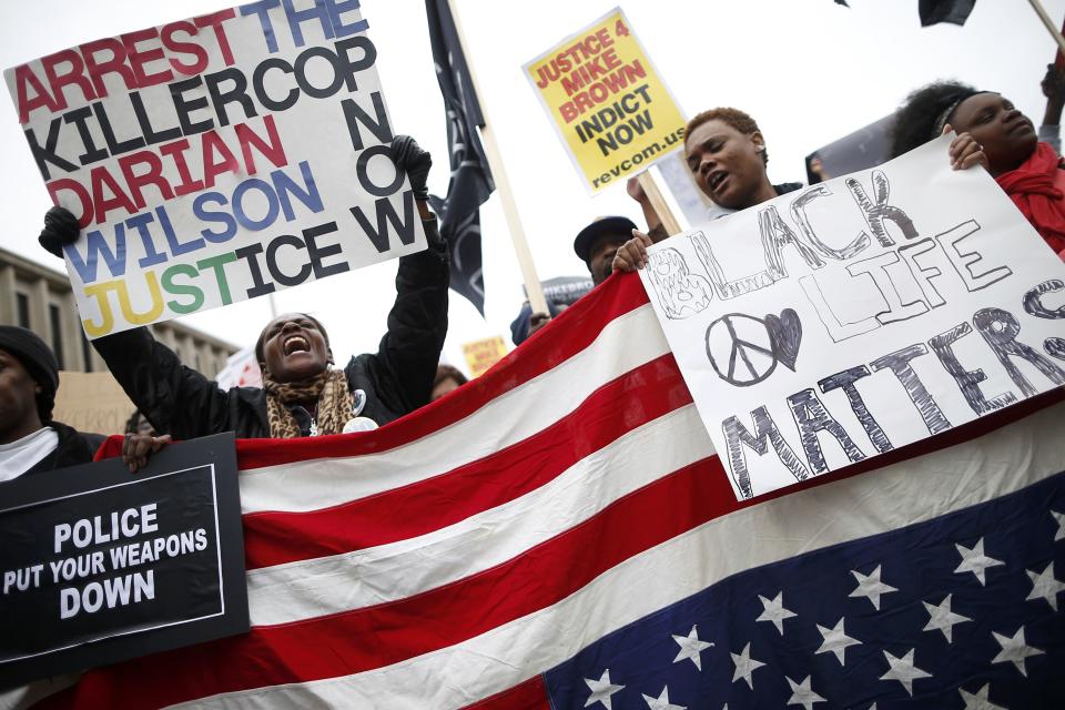 Protesters gather for the start of a rally in St. Louis, Missouri, October 11, 2014. (REUTERS/Jim Young) Click photo for slideshow of protests in Ferguson