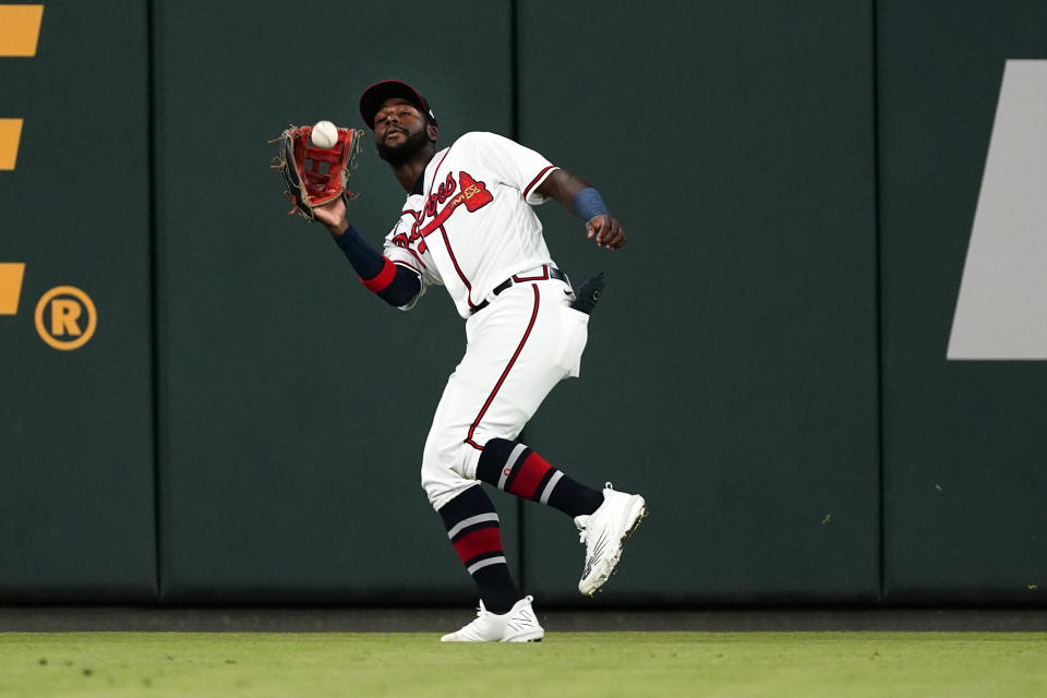 Atlanta Braves center fielder Michael Harris II (23) catches a fly ball from New York Mets' Brandon Nimmo during the sixth inning of a baseball game Tuesday, Aug. 16, 2022, in Atlanta. (AP Photo/John Bazemore)
