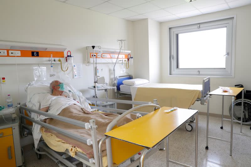FILE PHOTO: A patient suffering from the coronoavirus disease (COVID-19) is seen at the San Filippo Neri hospital in Rome