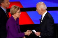 Democratic 2020 U.S. presidential candidate Senator Elizabeth Warren shakes hands with former Vice President Biden at the end of the seventh Democratic 2020 presidential debate at Drake University in Des Moines, Iowa, U.S.