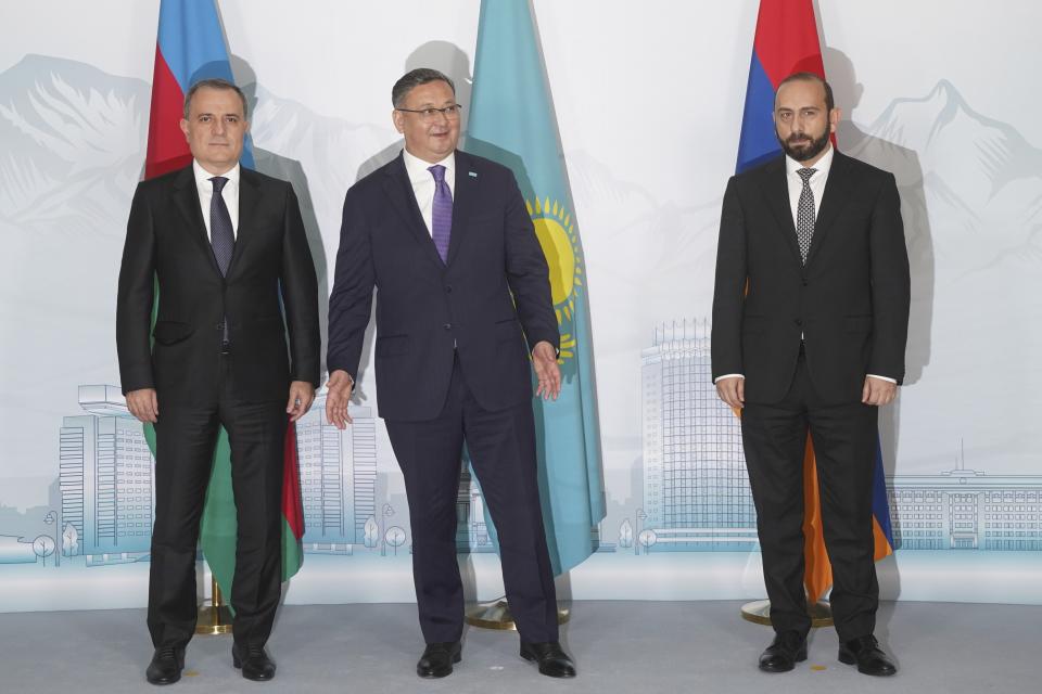 Azerbaijan's Foreign Minister Jeyhun Bayramov, left, Kazakhstan Foreign Minister Murat Nurtleu, center, and Armenian Foreign Minister Ararat Mirzoyan pose for a photo prior to their talks in Almaty, Kazakhstan, Friday, May 10, 2024. (Vladimir Tretyakov/NUR.KZ via AP)