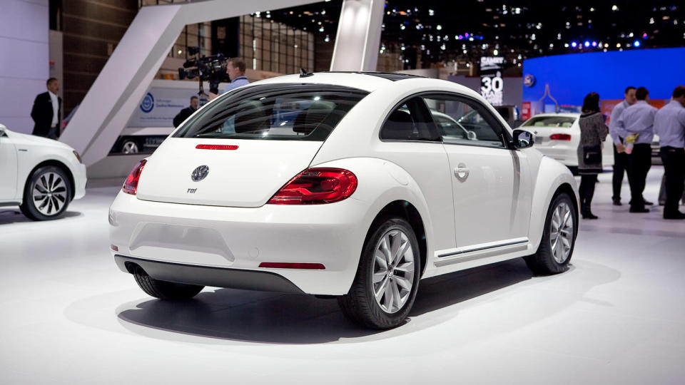 Volkswagen just unveiled the 2013 Volkswagen Beetle TDI, an oil-burning version of the recently revised and manliness-infused Beetle. America's only diesel two-door (VW considers this a coupe and the Golf a hatch) will go on sale this summer. The engine is VW's familiar 2.0 liter turbocharged and direct-injected 4-cylinder, now sporting a common-rail fuel injection setup and putting 140 horsepower and 238 lb/ft of torque into your choice of six-speed transmissions: either a traditional manual or the DSG semiautomatic. EPA fuel economy scores of 29 mpg city and 39 mpg highway have been confirmed.