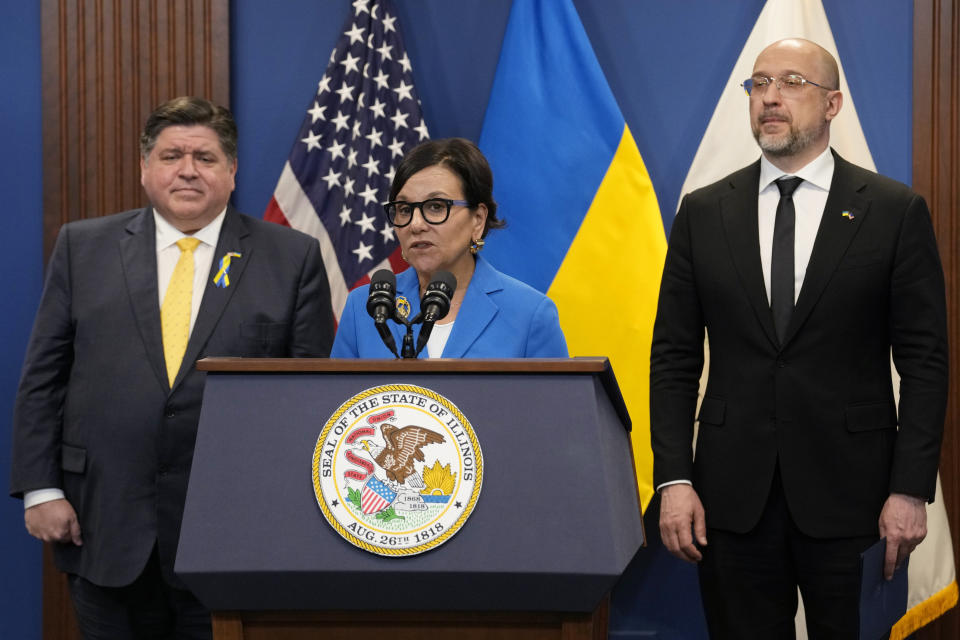 U.S. Special Representative for Ukraine's Economic Recovery Penny Pritzker, center, speaks as Illinois Gov. J.B. Pritzker, left, and Ukrainian Prime Minister Denys Shmyhal listen to her at a news conference in Chicago, Tuesday, April 16, 2024. They delivered joint remarks recognizing the Illinois-Ukraine partnership. (AP Photo/Nam Y. Huh)