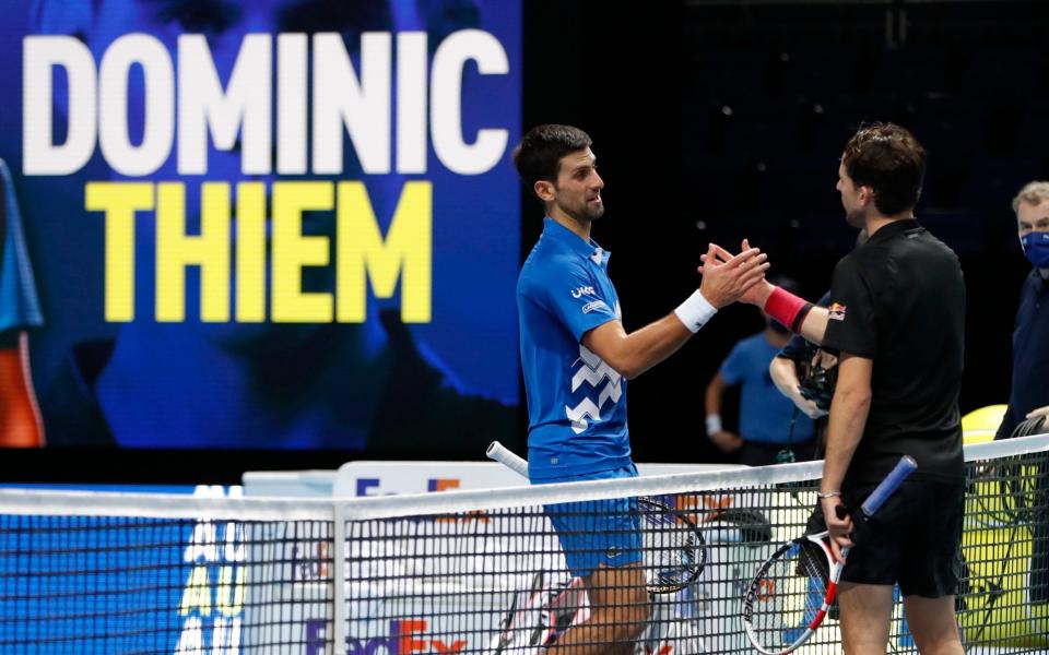 Djokovic and Thiem shake hands after the latter's victory in their semi-final - ACTION IMAGES