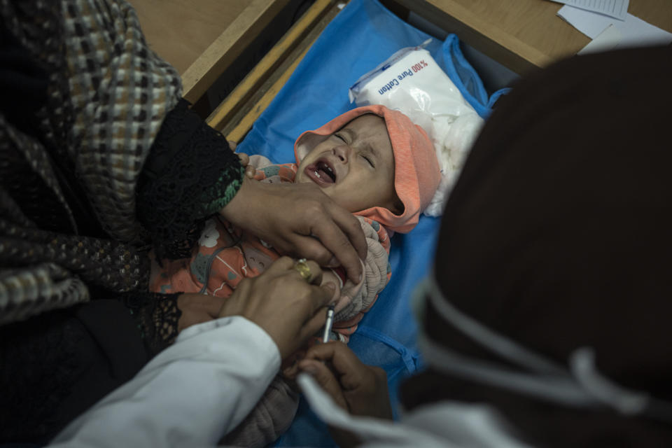 Palestinian children receive pentavalent vaccines in Rafah, Gaza Strip, Tuesday, Jan. 2, 2024. The vaccines, which protect against five diseases, recently entered Gaza in an international aid shipment and due to the ongoing war, most children are several months late for their immunizations. (AP Photo/Fatima Shbair)