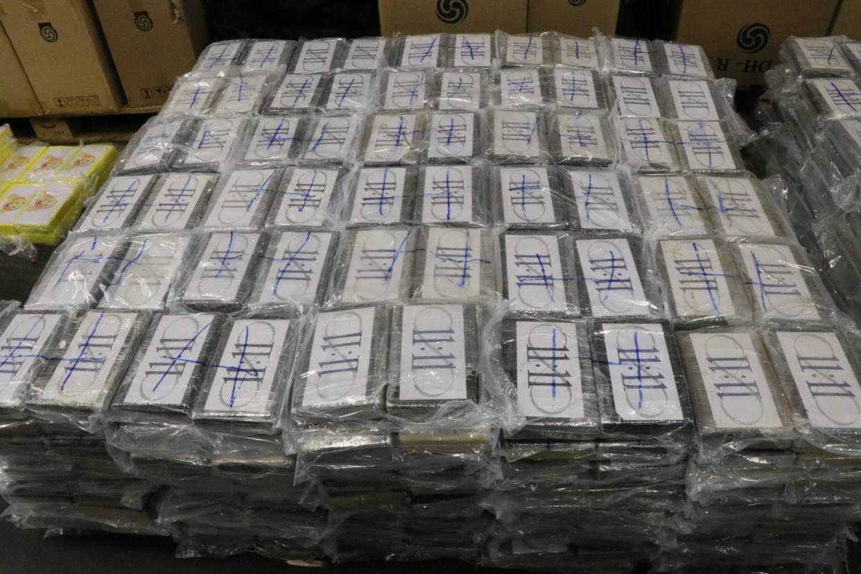In this handout photo from July, 2019 German customs authorities seize 4.5 tons (nearly 5 U.S. tons) of cocaine in a container shipped in Hamburg, Germany, from Uruguay, a haul with an estimated street value of nearly 1 billion euros ($1.1 billion). The customs office in Hamburg says that the drugs were seized two weeks ago when it checked the container that was en route from Montevideo to Antwerp, Belgium. (German Custom via AP)