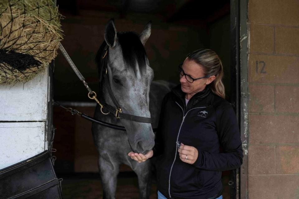 Trainer Jena Antonucci gives a treat to Arcangelo, who was the 7-2 second choice in Saturday’s Breeders’ Cup Classic at Santa Anita before being withdrawn from the race on Tuesday.