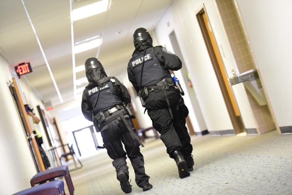 Port Huron Police Department officers check rooms for an active shooter during the active killer training on the campus of St. Clair County Community College in Port Huron on Tuesday, August 9, 2022.