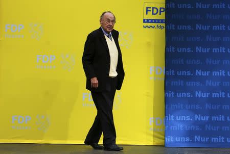 Hans-Dietrich Genscher of the liberal Free Democratic Party (FDP) enters the stage during an election rally of FDP top candidate for the upcoming general elections, Rainer Bruederle, in Frankfurt, Germany in this file picture taken September 20, 2013. REUTERS/Ralph Orlowski/Files