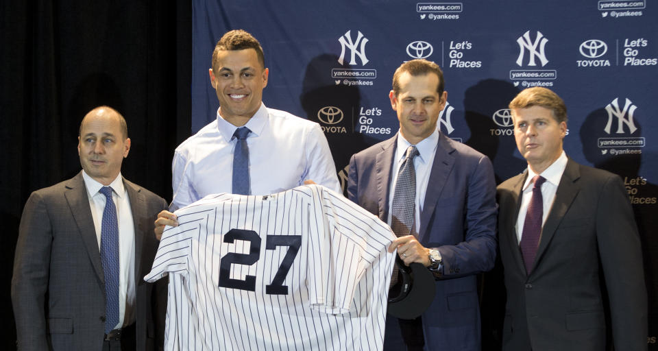 From left to right, Brian Cashman, Giancarlo Stanton, Aaron Boone, and Hal Steinbrenner will be expected to compete for a World Series. (AP)